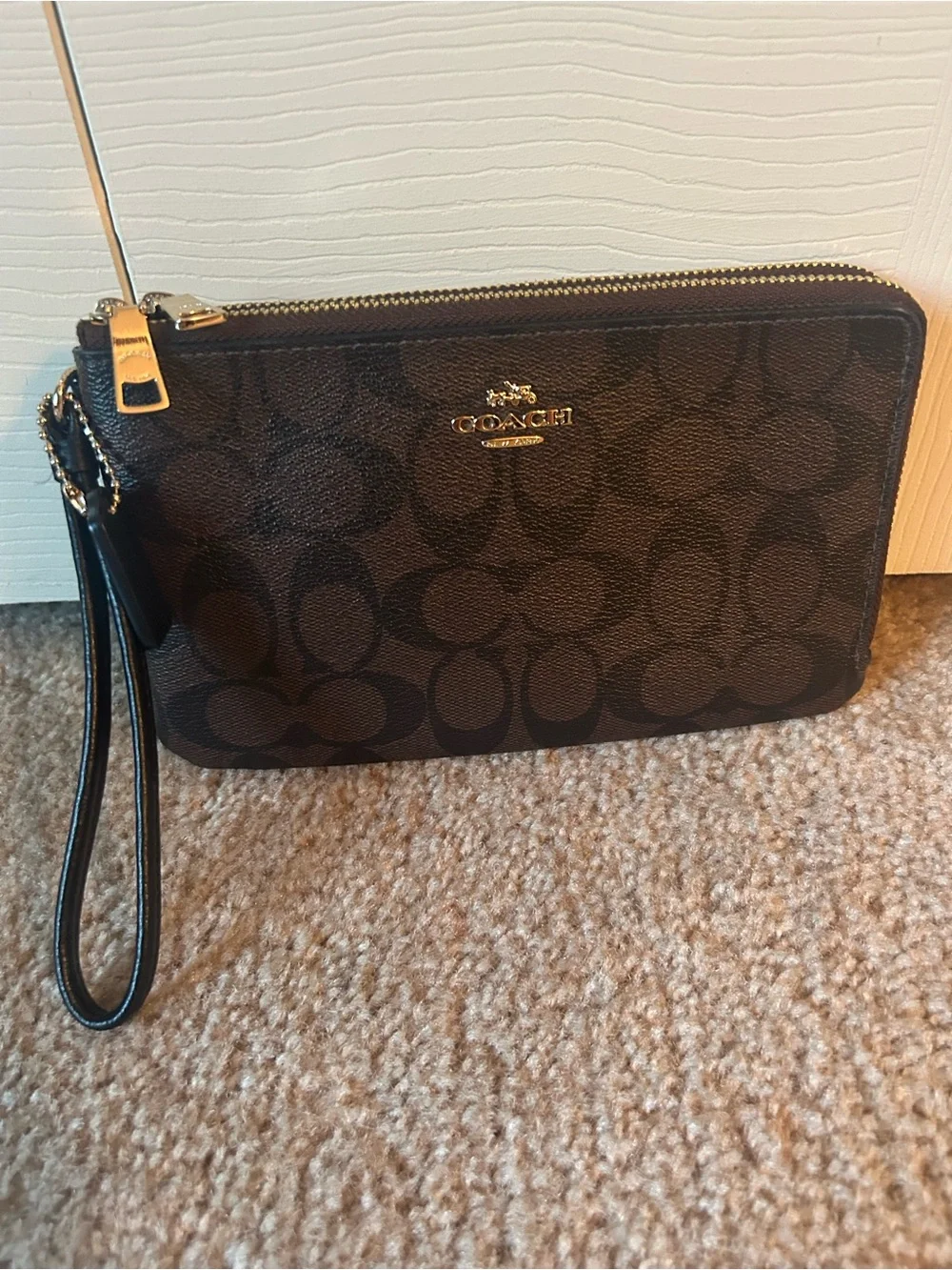 Coach Monogram Double Zip Wristlet in Brown and Black with Gold Hardware. F16109